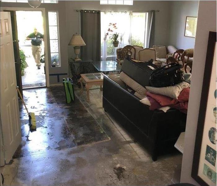 Front Room with water on the floor from pipe damage